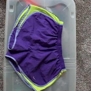 Purple and neon Nike shorts.